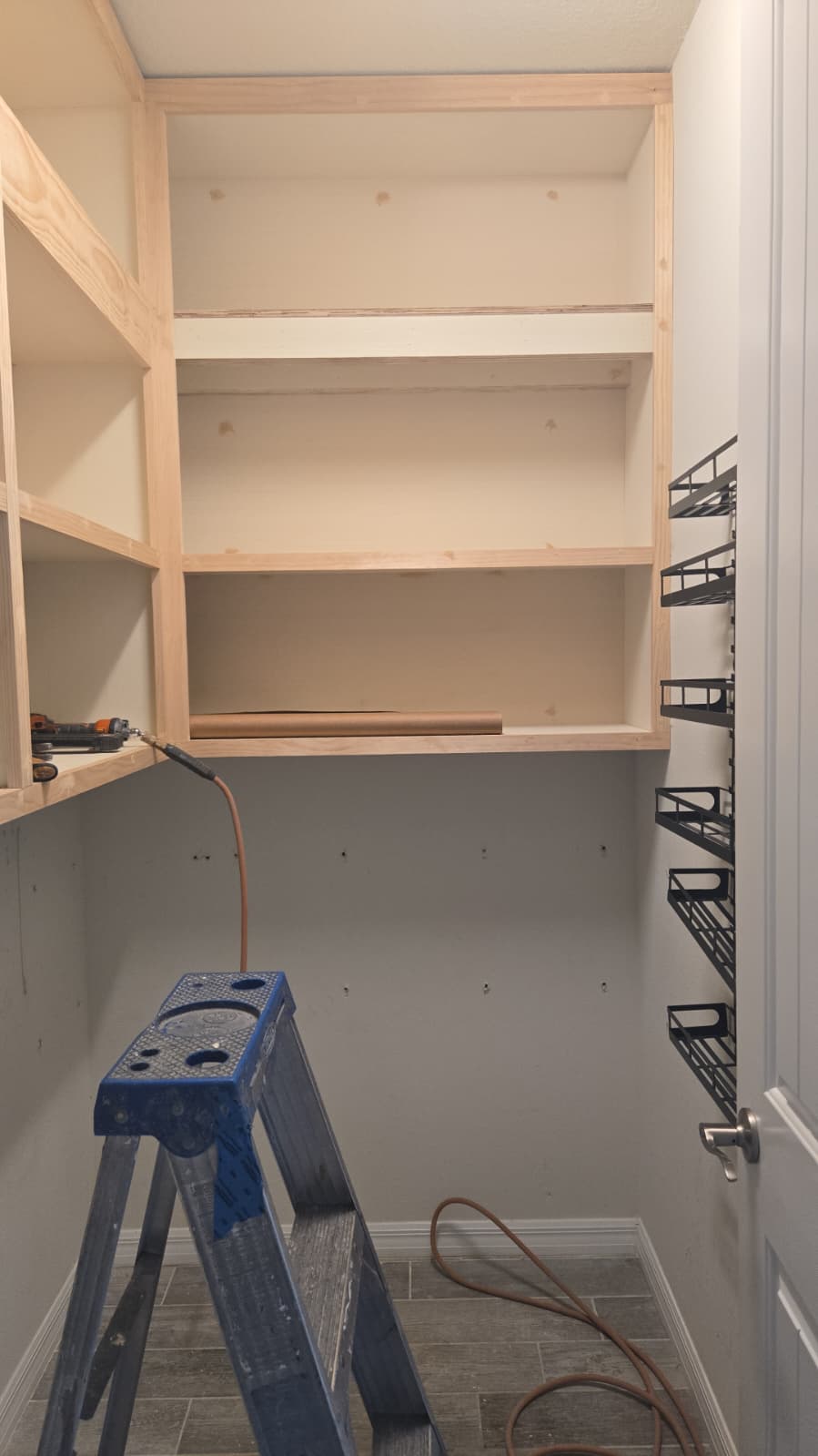 Custom pantry shelving designed for maximum kitchen organization.