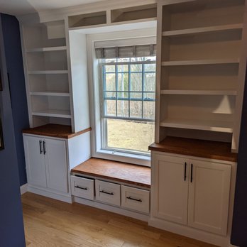 Elegant crown molding installation in a modern living room.