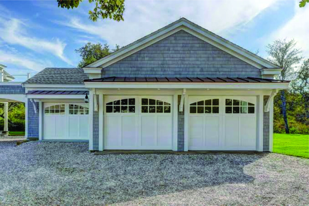 Clean garage with epoxy-style flooring and painted walls.
