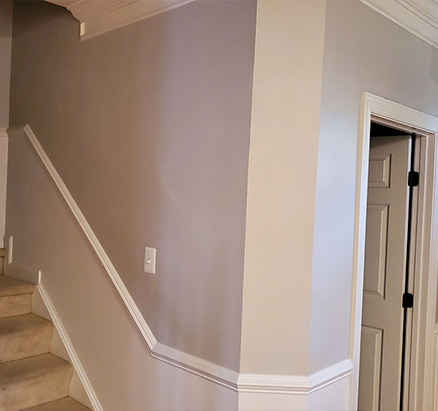 Elegant crown molding installed in a modern living room.
